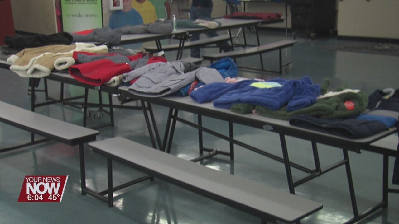 Students receive coats for school during Saturday event